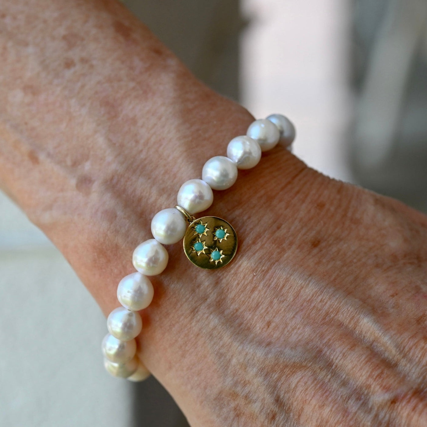 Pearl Bracelet with Turquoise Starburst Charm